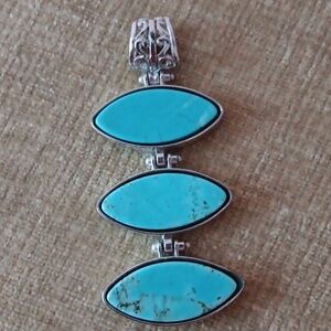 Three Stacked Silver Tone Oval Hinged Turquoise Pendant